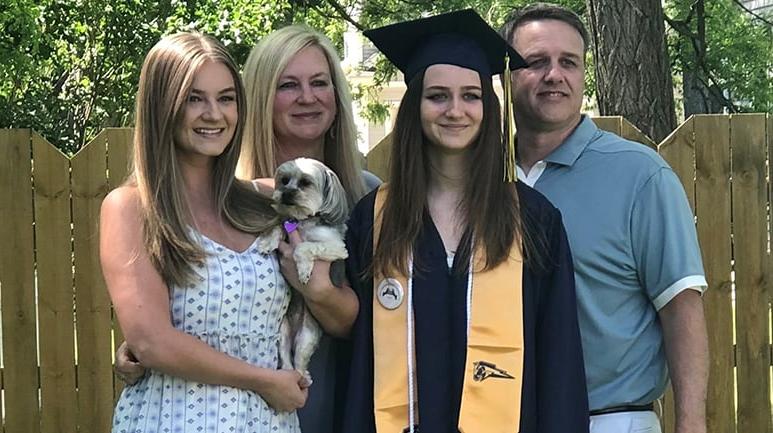 Holly and family at graduation 